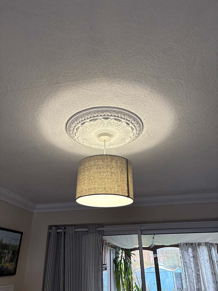 Completed repair with ceiling light safely restored and working