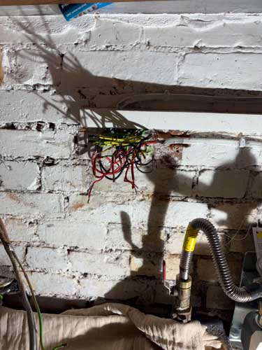 Exposed wiring before consumer unit replacement in Leicester