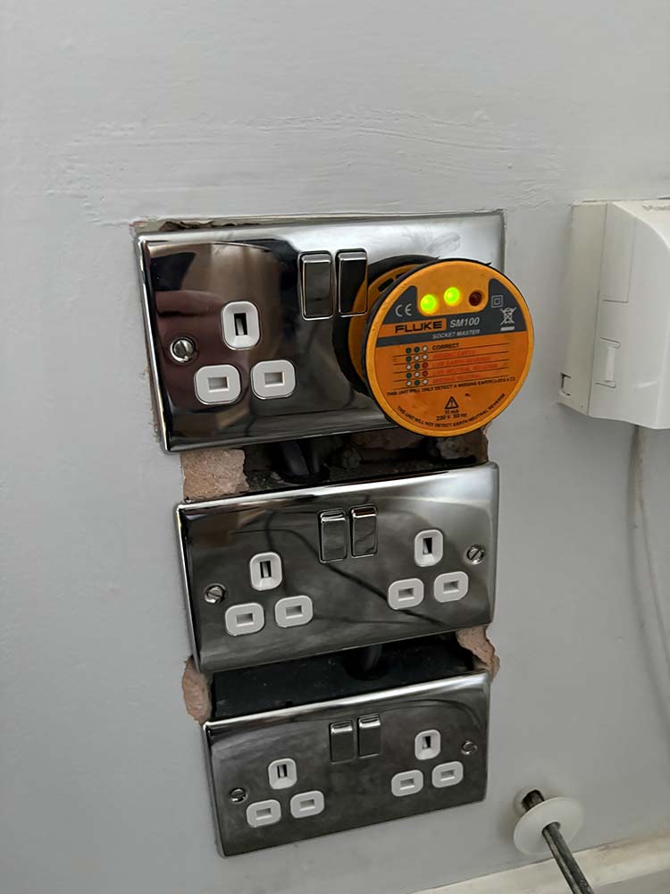 Chrome double sockets being checked with a socket tester